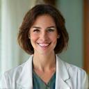 Portretul doamnei Elena Dumitrescu, psiholog clinician Vitalis Meridiem, cu o expresie empatică și deschisă, într-un cadru de birou relaxant.